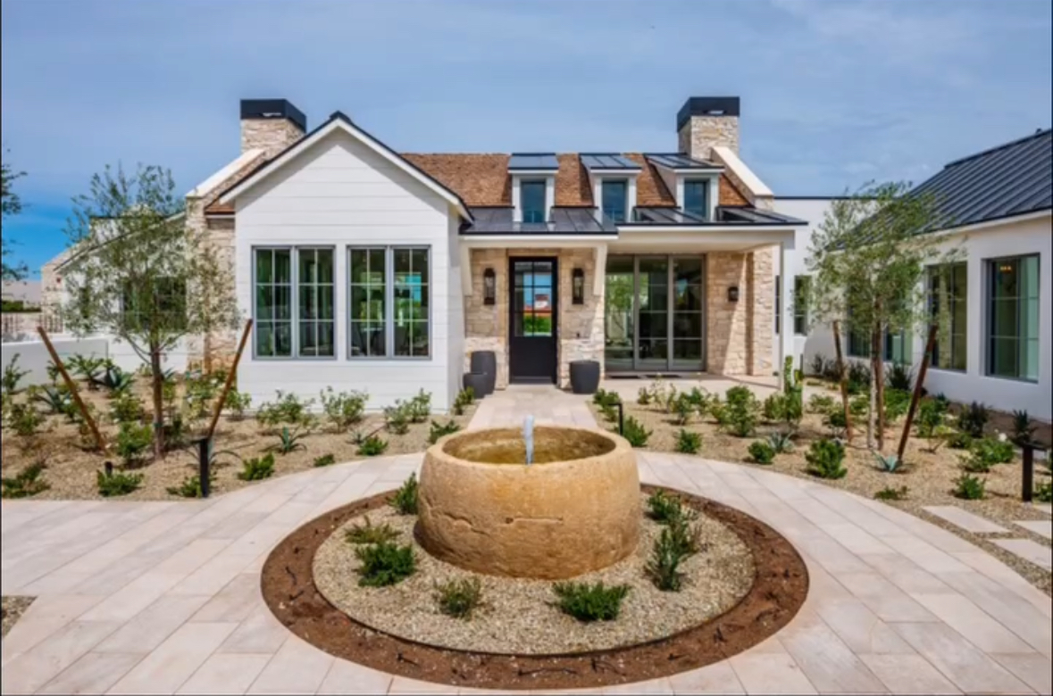 Belmont- Modern house with a circular fountain in the middle of the garden area