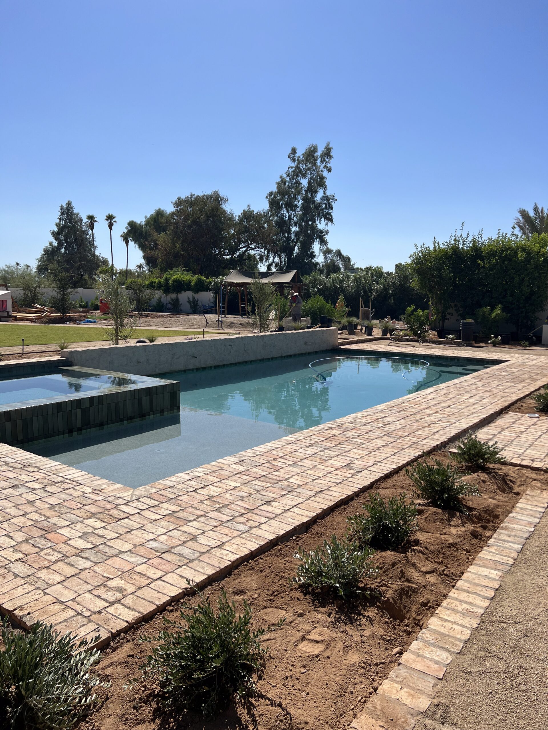 Outdoor view of a desert landscape and a pool