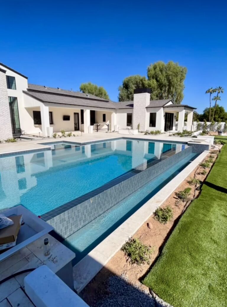 White modern house and pool outside
