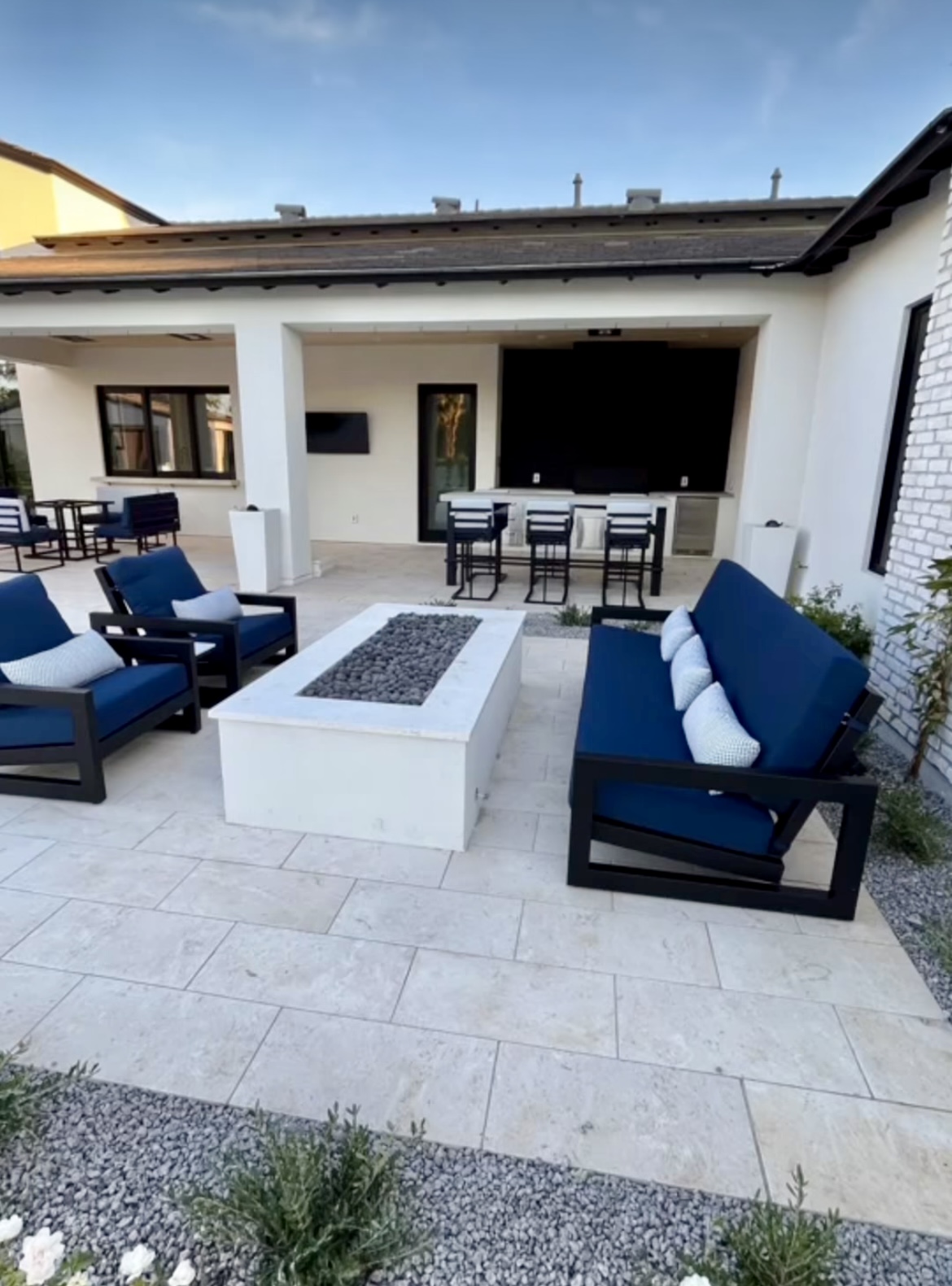 Modern white house with outdoor chair and table sets